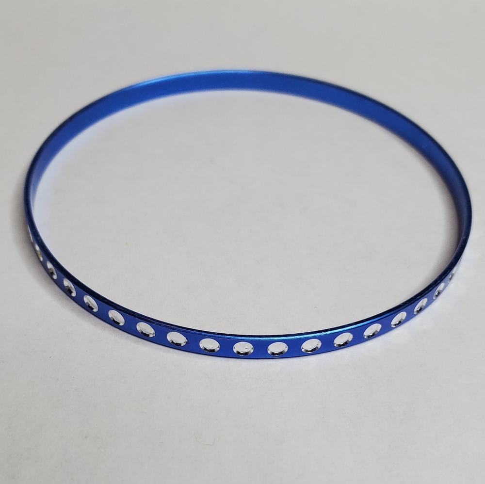 Blue bangle bracelet with white dots around
